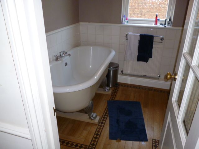Heritage property bathroom with clawfoot bath
